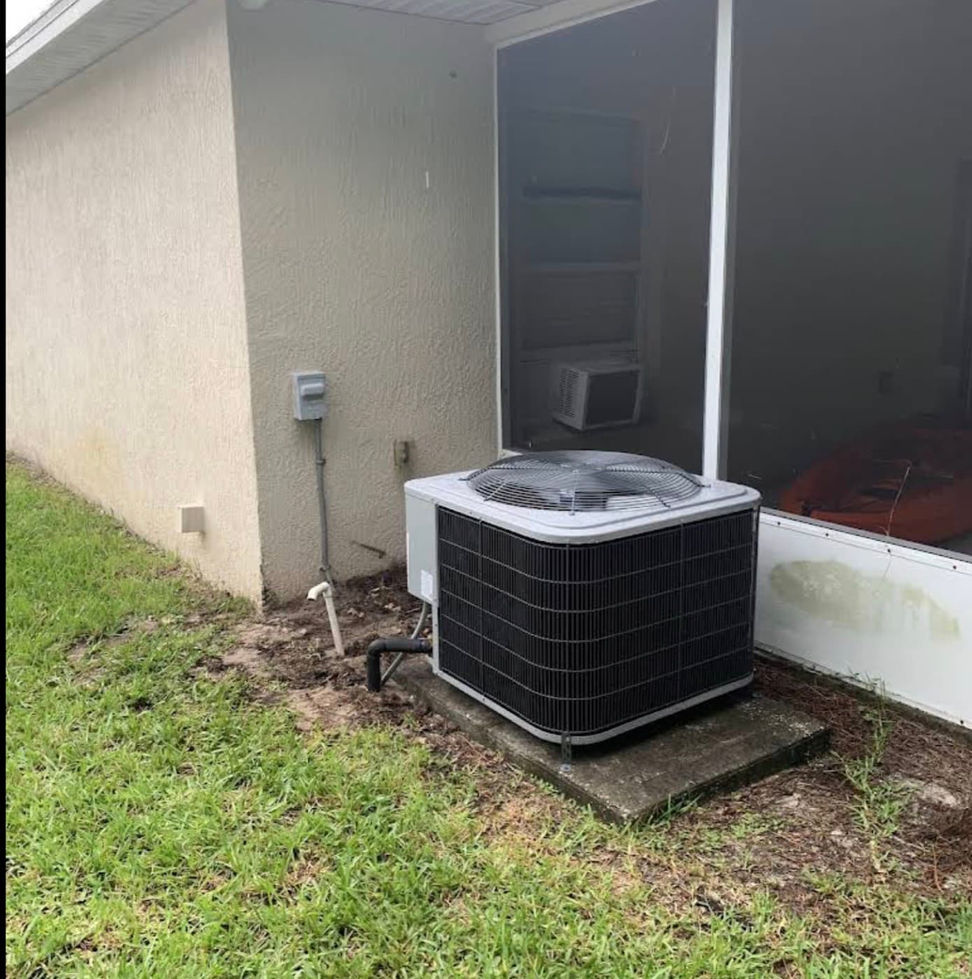 Outdoor AC condenser unit installed